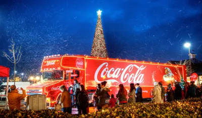 Christmas tree coca cola truck lights night sky