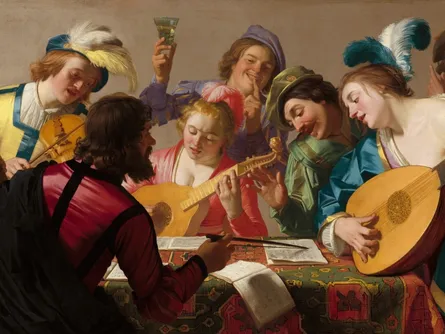 A group of musicians gather around a table