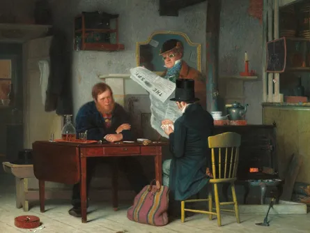 Three men gathered around table