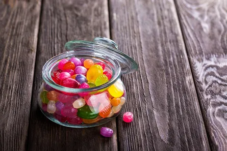 Colorful candy in glass jar