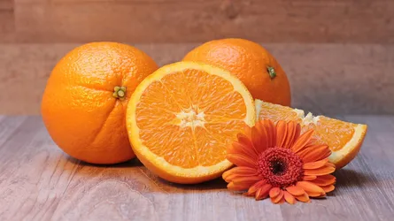 Two oranges and flowers