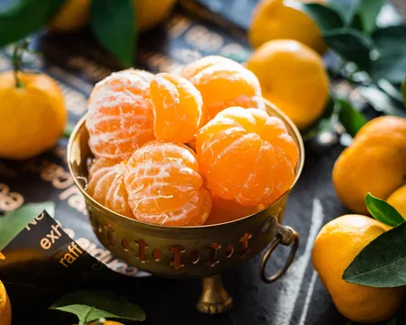 Oranges in bowl on table