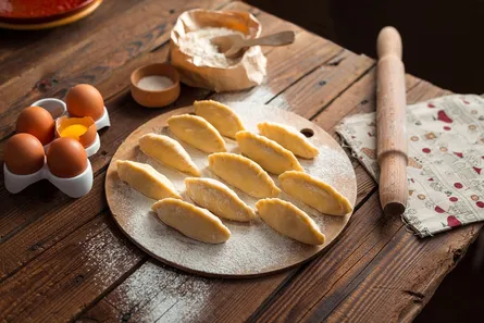 Cookies in shape of fish on wooden table