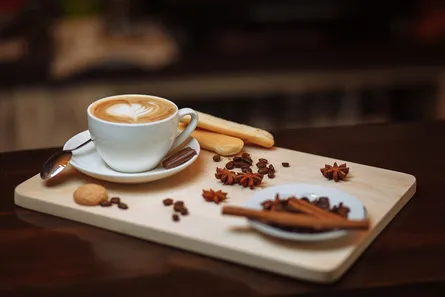 Coffee, cookie, cinnamon sticks