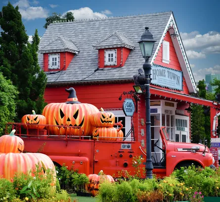 Red house, pumpkins, truck