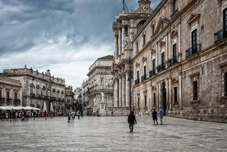 Grey sky, old city, courtyard, people