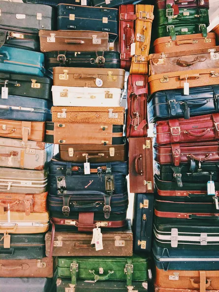 Large pile of suitcases