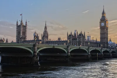 Bridge, clock tower and flag