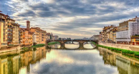 Sunlit village by canal