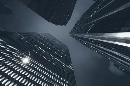 Tall skyscrapers against dark, cloudy sky