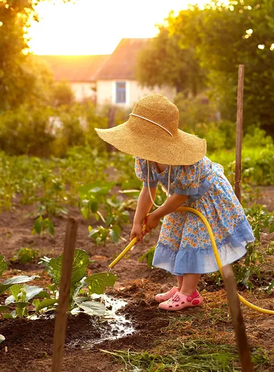 Child watering plants
