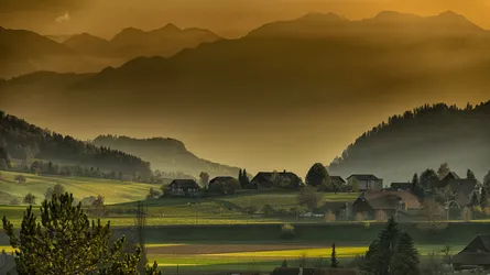 Misty mountains, lush green field