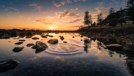 Sunset, rocks and water