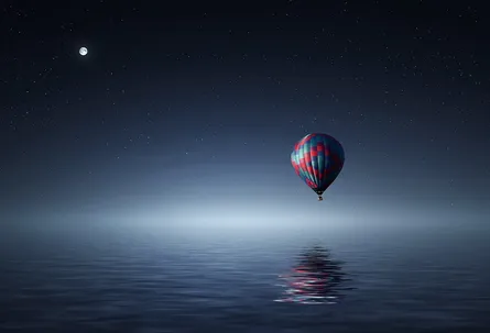 Hot air balloon floating on water