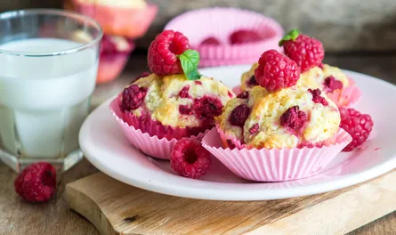 Fresh raspberry muffins on plate