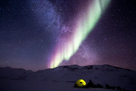 Northern lights over mountains