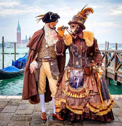 Costumed couple at water