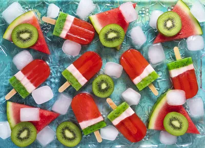 Watermelon slices with toothpicks and kiwi